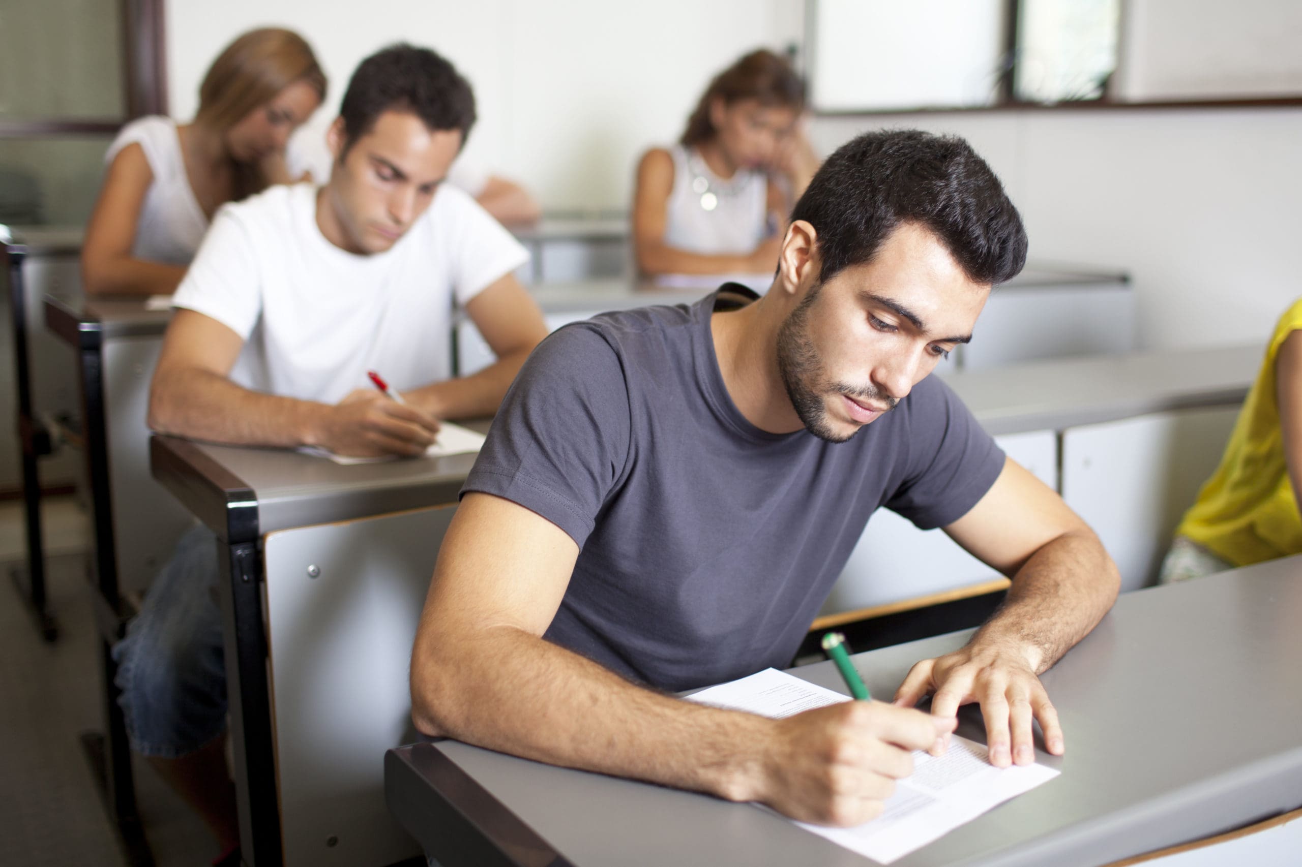 Student s test. Мужчина студент. Парень на экзамене. Экзамен Сток. Тестирование стоковые фото.