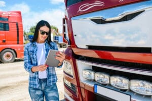 Female truck driver using a mobile app