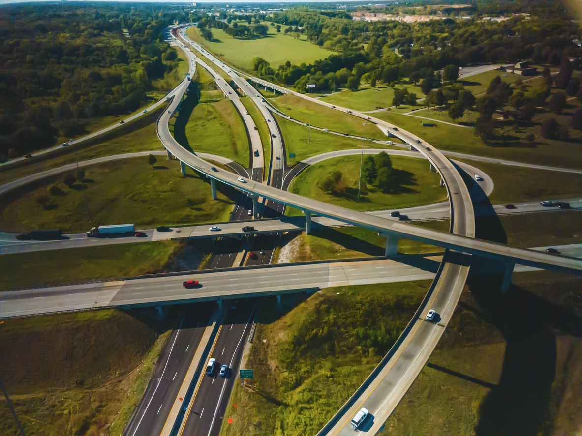 Commercial Semi Truck Cargo Transport Hauling Freight on an Interstate Highway in the Midwest USA Afternoon 