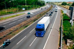 Orange Lorry on a motorway in motion near London, United Kingdom