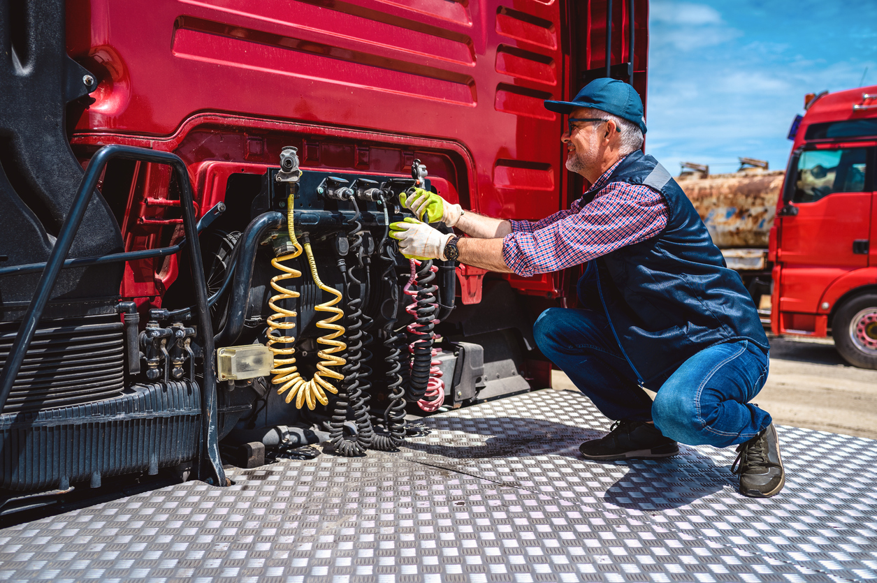 The truck driver checks the correctness of the truck. Controlling vehicle before transportation service