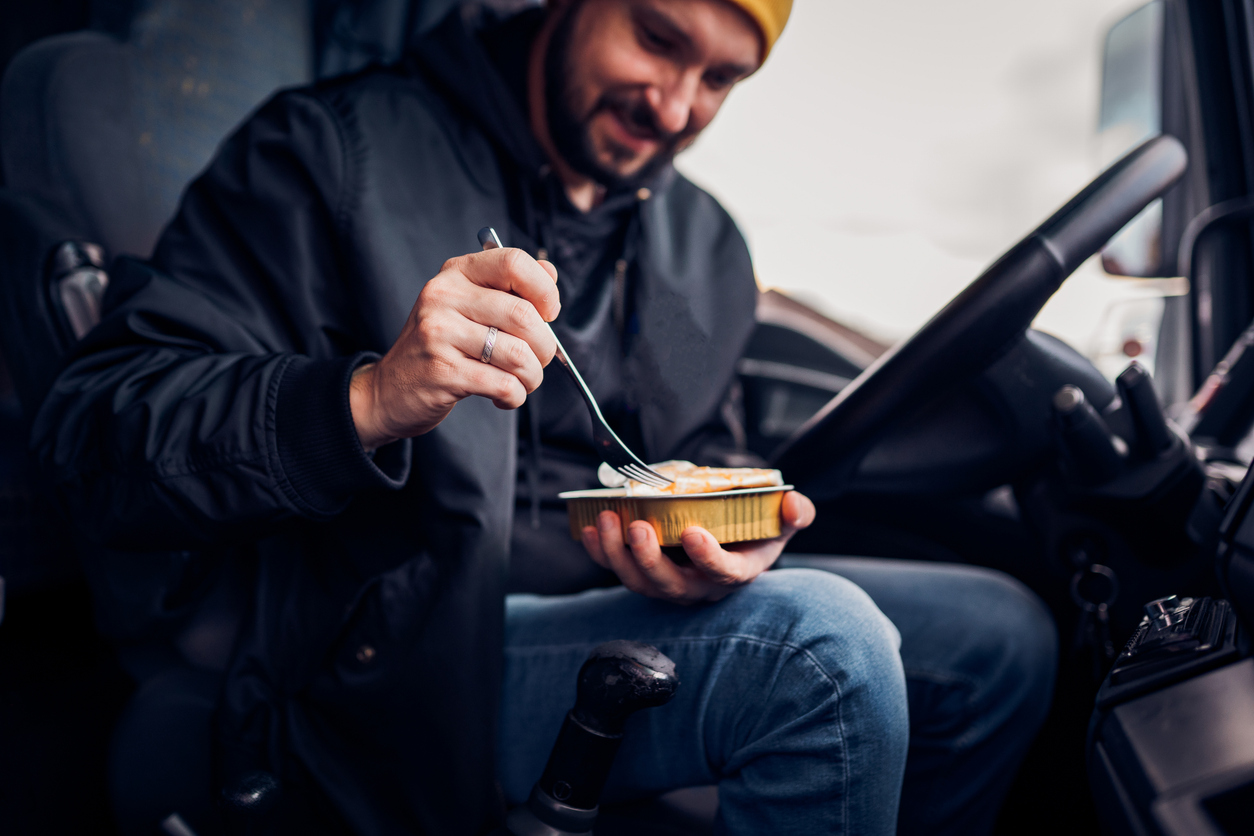 Truck driver eating healthy on the road