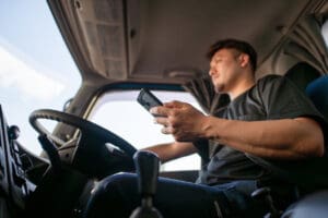 Truck driver performing a pre-trip inspection at TDI’s training facility.